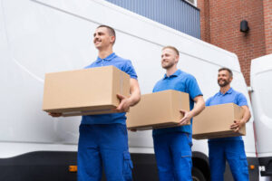 Truck Movers Loading Van Carrying Boxes And Moving House