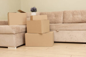 Cardboard boxes on the floor in the room. Concept of moving or delivery, sale or purchases